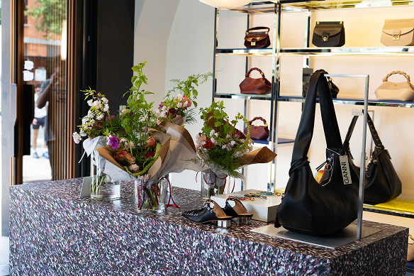 Display of handbags and flowers in a store setting in Austin Texas